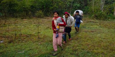A family in Kayah state moves in search of shelter.